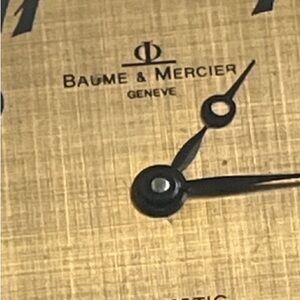 Baume & Mercier Gold Watch with Black Accents